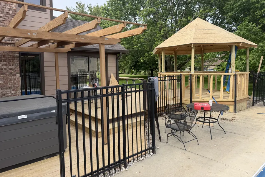 A finished ZKB outdoor build: pergola, gazebo and hot-tub patio in the evening.